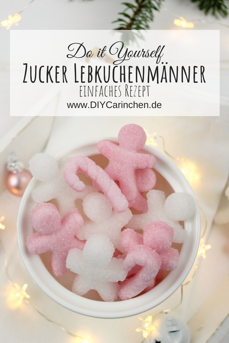selbstgemachte Lebkuchenmänner aus Zucker in rosa und weiß